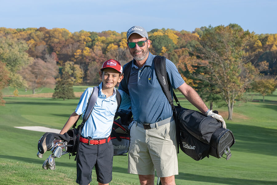 young golfer with mentor