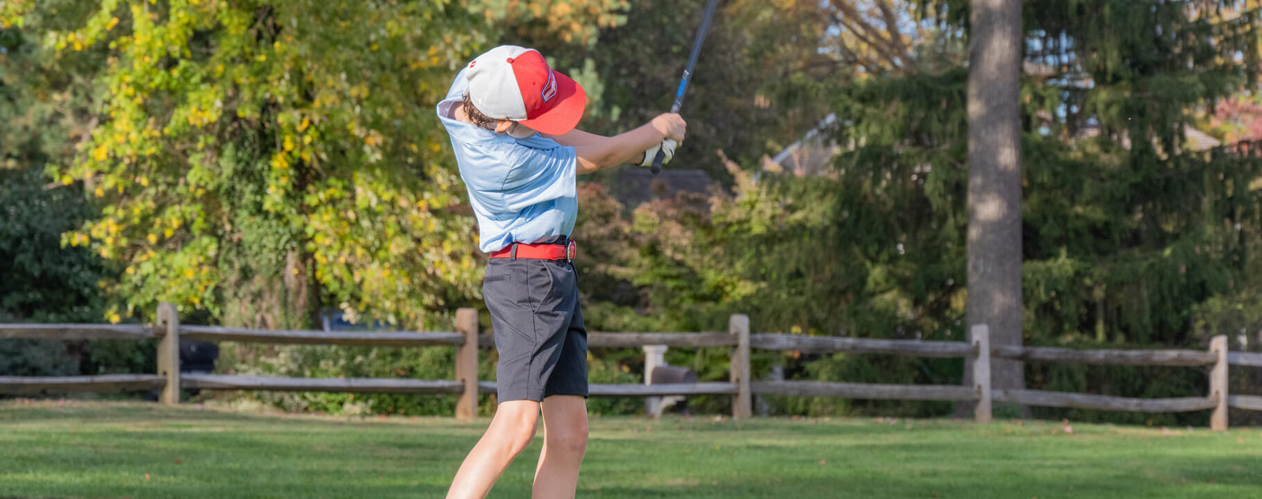 young golfer in full swing